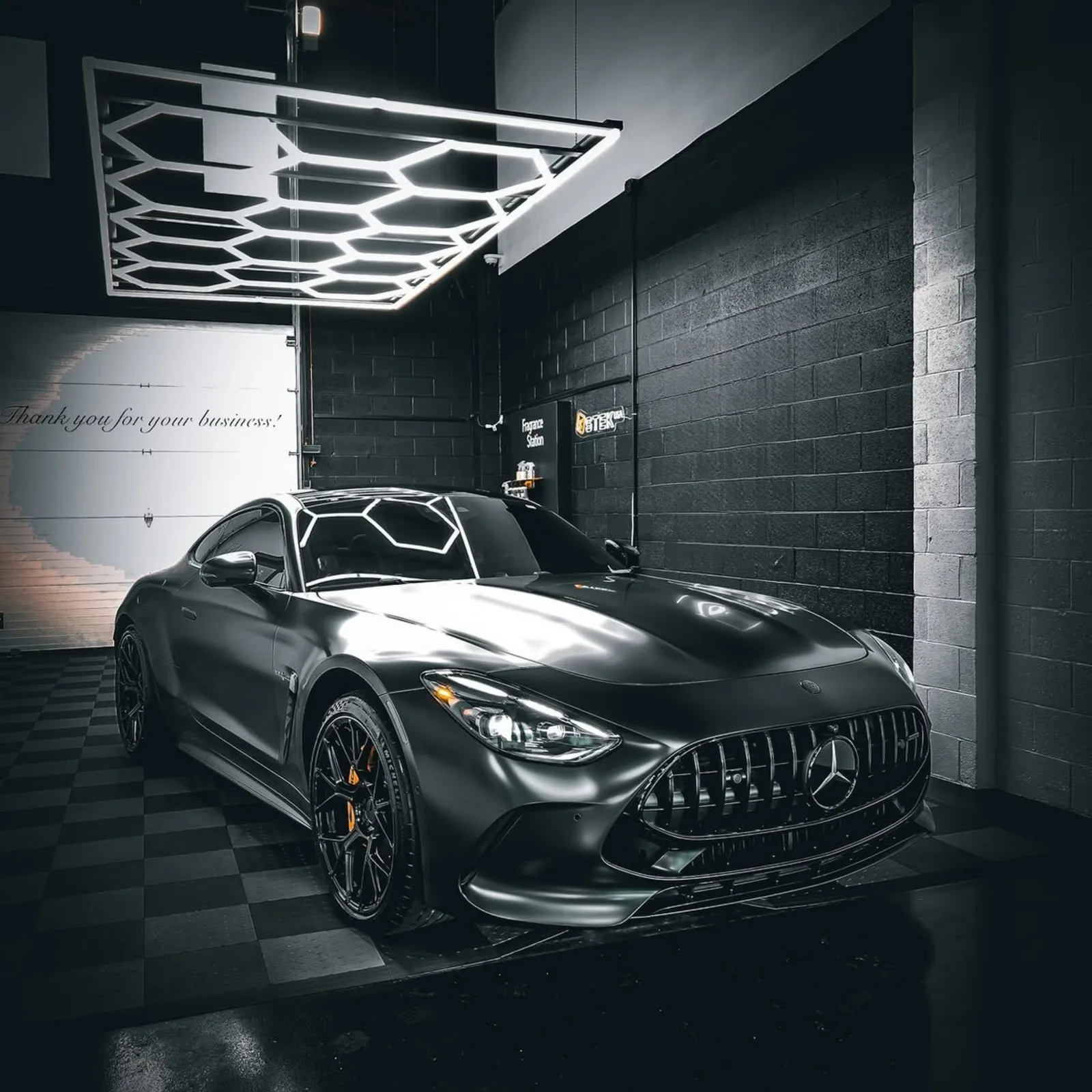 Mercedes-AMG GT under workshop lighting after a full ceramic coating