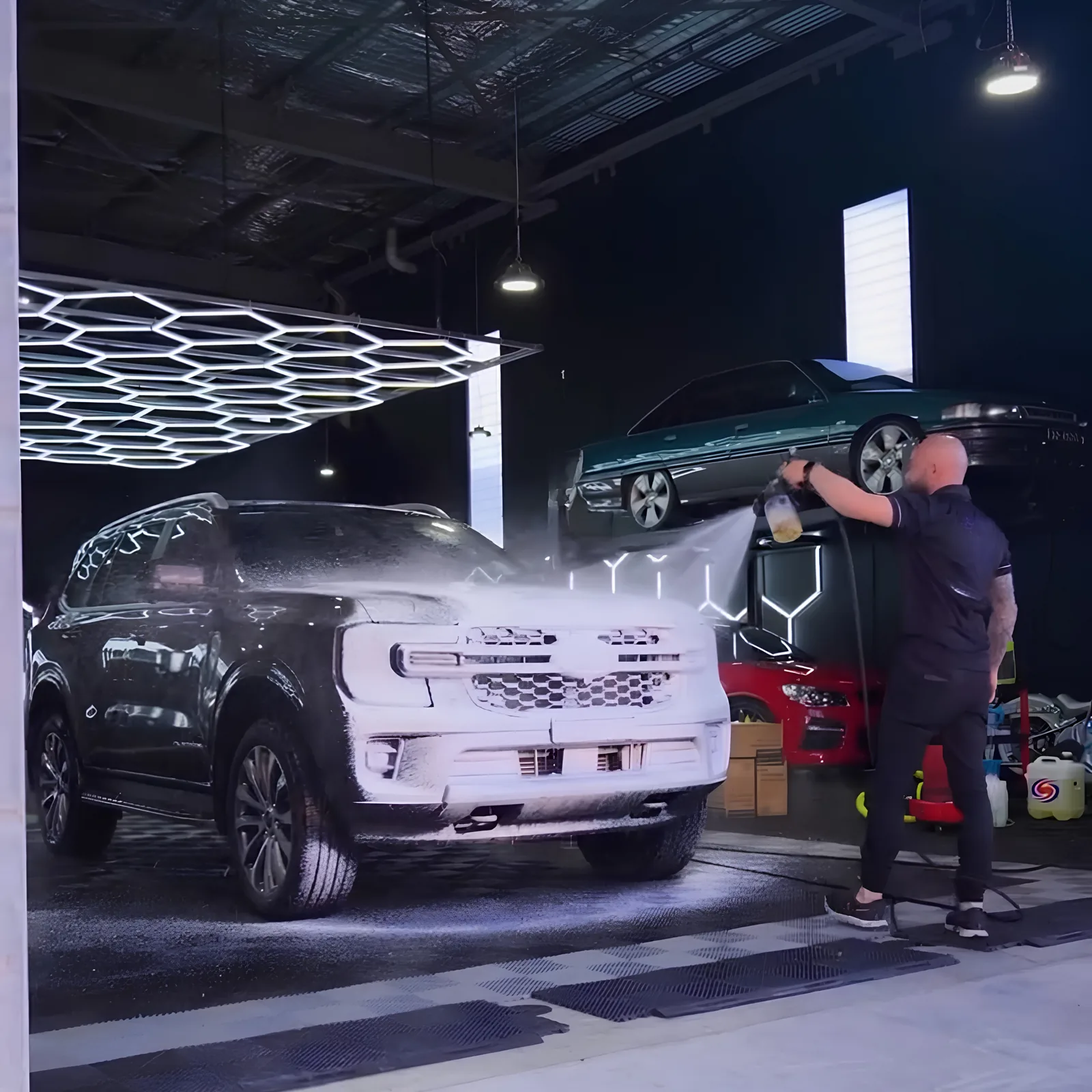 SUV covered in snow foam during the decontamination stage